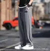 Pantalones de seda de hielo Amazon transfronterizos, pantalones cortos de secado rápido para hombre, pantalones largos casuales de estilo coreano modernos de corte holgado, pierna ajustada atlética