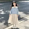 Conjunto de dos piezas para niña: una sudadera con cuello de muñeca y una falda midi de moda con lazo, perfecta para principios de otoño, adecuada para la escuela