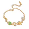 Pulsera de Acero Inoxidable Chapado en Oro de 18K con Diseño de Trébol de Cuatro Hojas y Goteo de Aceite, Estilo Tranquilo y Dulce para Mujer, Joyería Transfronteriza de Lujo Ligero con un Diseño Único