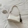 Bolsa de axila modelo nuevo de verano 2026, única y elegante, bolso de mano de alta calidad para el trabajo y los desplazamientos, bolso cruzado de un solo hombro de color sólido