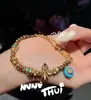 Pulseira Antiga de Ouro com Pedras Turquesa e Cravejada de Diamantes em Formato de Roda de Flor Vajra Envolvente para o Pulso Novo Estilo Chinês Sonho Bêbado Rio Estrelado Pulseira Estrela