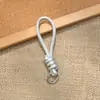 Bolsa de Corda de Couro PU Colorida Pingente Estilo Miu Simples Versátil Charme de Bolsa Chaveiro Acessório Lanyard de Celular Estilo Curto Novo