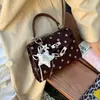 Bolso Kelly nuevo y versátil para mujer 2026, lujo ligero, moderno, de nicho, cuadrado pequeño, para ir al trabajo, bolso de mano de lunares