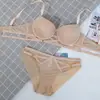 Popular sujetador strapless sin costuras de estilo europeo y americano para mujer, realza los bustos pequeños, proporciona elevación y previene la flacidez, conjunto de sujetador