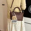 Bolso cruzado tejido de diseño de nicho nuevo 2026, bolso de mano versátil casual para mujer, estilo albóndiga