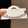 Pulseira de zircônia em formato de cruz da moda para mulheres, nicho de luxo leve, alta costura, joias versáteis para atacado