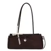 Bolso de hombro tipo baguette de moda y tendencia estilo coreano transfronterizo para mujer, nuevo modelo 2026, simple, delicado, dulce, con lazo