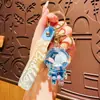 Astronauta Jelly Bean Botella Flotante Colgante para Mochila Astronauta de Dibujos Animados Llavero para Coche Regalo Pequeño para Pareja Venta al Mayoreo