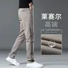 Pantalones de negocios casual de alta gama para otoño e invierno para hombre, pantalones grises rectos de corte slim, nuevos pantalones de invierno para hombre con forro polar 2026