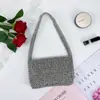 Bolso tejido a mano con cuentas de plata brillante, simple y versátil, bolso de mano con solapa, bolso de teléfono acrílico casual de lujo ligero exquisito