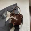 Bolsa de Balde Portátil de Grande Capacidade de Nicho Transfronteiriça Feminina Verão 2026 Nova Bolsa Tote Tecida de Cor Sólida Ombro Único Transversal