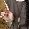 Nuevo collar retro estilo chino de plumas y hojas, estilo étnico, cadena versátil de nicho para suéter, joyería de lujo ligero de alta gama al por mayor
