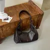 Elegante bolso de hombro retro de gran capacidad para mujer, un bolso tote de alta gama adecuado para ir al trabajo, versátil y con un diseño texturizado, perfecto como bolso de axila