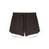 Pantalones cortos de running y fitness para hombre, talla europea, de nailon elástico en cuatro direcciones, corte ajustado, con forro interior, para deportes y actividades al aire libre