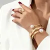Conjunto de Pulsera y Anillo Dorados Inspirados en el Diseño Europeo y Americano Transfronterizo, Moderno y Único, Exagerado Estilo Abierto Joyería de Lujo Ligero Conjunto de Dos Piezas