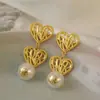 Pendientes de Perla Flor de Amor Hueca Estilo Retro Francés Personalidad Elegante Antiguo Alta Calidad Nicho Lujo Ligero Pendientes
