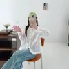 Colección Otoño 2026: Cuello de encaje estilo japonés, dobladillo abotonado de colores, blusa casual de manga larga con encaje para mujer