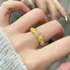 Tienda de oro Puzuo con el mismo estilo bolsa de cuerno cepillado diamante arena dorada anillo para mujer nicho único estilo extranjero anillo abierto