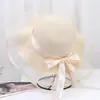 Nuevo Sombrero de Paja para Mujer Verano Viaje Sombrilla Sombrero Playa Mar Protector Solar Sombrero Estilo Coreano Ala Ancha Moño Anti-UV