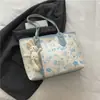 Bolsa Grande de Cor Contrastante para Mulheres 2025 Outono e Inverno Nova Bolsa de Ombro com Estampa de Desenho Animado Fofa Bolsa Tote Versátil e Moderna