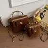 Coleção nova 2026 transfronteiriça: uma bolsa de ombro, bolsa transversal e bolsa de mão de nicho, de alta qualidade e versátil, com corrente e design de caixa inspirados na Chanel