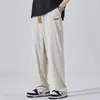 Pantalones Casuales para Hombre Primavera y Otoño 2026 Nuevo Estilo Holgado Caída Pierna Recta de Moda Marca Ins Pantalones Deportivos Color Sólido con Parche