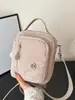 Bolsa Pequena de Tecido Versátil Leve para Mulheres 2025 Nova Bolsa de Mão Casual para Uso Externo Ombro Único Transversal Bolsa para Celular