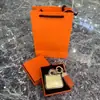 Llavero de bolsa de papel de aluminio de oro 999, colgante de teléfono chapado en oro, recuerdo de evento corporativo, regalo de bolsa de marca