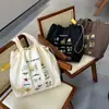 Bolsa de Hombro con Cordón Artística Versátil Bordada Linda Estilo Perezoso Gran Capacidad Colores Dulces Primavera y Verano