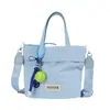 Bolso tipo cubo de lunares rojos estilo coreano para mujer, nuevo modelo 2026, bolso cruzado casual ligero de lona, bolso de mano pequeño para el trabajo y artículos varios