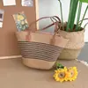 Bolsa de vacaciones en la playa para mujer, nueva bolsa de hombro tejida de verano 2025, gran capacidad, bolso tipo cubo de paja para debajo del brazo