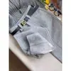Nova coleção de inverno: Calças retas de mistura de lã cinza, de cintura alta, modeladoras e que valorizam a silhueta para mulheres, exalando um estilo sofisticado e elegante, perfeitas para o vestuário de trabalho.