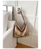Bolsa de Axila Estilo Preguiçoso Casual Retrô Feminina 2026 Nova Bolsa Simples de Lona Estampada de Leopardo Moda Carta Bolsa de Ombro Único