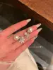 Recuerdo de nieve temprana ~ aretes de perlas de copo de nieve sentido de atmósfera diseño de nicho aretes de dos piezas para mujer nuevos aretes de Corea del Sur