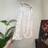 Zhi LiNovo Estilo Chinês Jacquard Borla Meia Saia Feminina 2026 Verão Novo Estilo Botão de Sapo Fenda Lateral Saia Suave