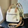 Bolso de hombro nuevo, minimalista y elegante, un bolso tote de lona versátil para el uso diario, ir al trabajo, ir de compras, y se puede llevar como bolso cruzado.