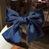 Clip de resorte con lazo de perla, accesorio para el cabello de alta gama, elegante y francés para celebridades de Internet.