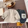 Conjunto de Tres Piezas de Chaqueta de Dibujos Animados para Niños Novedades de Otoño 2026 Rompevientos Casual para Niños Pequeños Conjunto de Jeans para Bebé