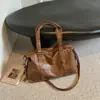 Bolso de gran capacidad para mujer, nuevo diseño 2026, estilo simple y retro, diseño de nicho popular de este año, bolso de hombro de otoño