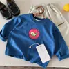 Otoño 2026 Huzhou Zhili Ropa Infantil Estilo Coreano Camiseta Básica de Manga Larga para Niños y Niñas Primavera y Otoño Camiseta Beige