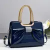 Luxo Leve Nova Moda Europeia e Americana Laço Couro Patente Diamante Versátil Uma Alça Transversal Bolsa de Mão Bolsa para Mãe de Meia-Idade