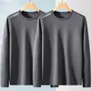 Camiseta de manga larga para hombre de color liso Sorona, versátil, corte holgado, cuello redondo, para primavera y otoño, top casual moderno