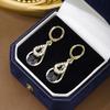 Corea del Sur Nueva Entrada Lujo Ligero de Alta Gama Pendientes de Gota de Agua con Incrustaciones de Diamantes Negros Huecos de Doble Capa Moda Femenina Simple Distintivo Aro para la Oreja