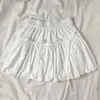 Saia Curta Rodada de Cintura Alta com Laço e Botão Floral, Versátil, Emagrecedora, Linha A, para Mulheres Baixinhas