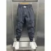 Pantalones holgados tipo harén con tobillo atado de estilo coreano para hombre, pantalones ajustados de línea brillante versátiles para jóvenes, pantalones casuales con tobillo atado de celebridad de Internet