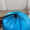Bolsillo con cordón de poliéster al por mayor Bolsa impermeable con cordón de nailon Bolsa de almacenamiento para ropa Bolsa de almuerzo de viaje Bolsillo encogido