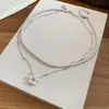 Collar Vintage Redondo de Perlas Multicapa Estilo Francés, Cadena Sencilla, Moderna, Elegante y Clásica para Clavícula con un Toque de Lujo Ligero y de Alta Gama
