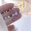 Pendientes de tuerca de circonita con forma de oreja súper llamativos para mujer, 2023, con diseño de oreja libre para dormir, decoración sencilla de alta gama.