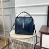 Bolso de piel de vacuno de primera capa, bolso de mujer de piel auténtica, nuevo bolso bandolera tipo cubo 2021, diseño de nicho, bolso de moda para mujer