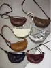 Bolsa Croissant de Pele de Ovelha Tanning Vegetal Bolsa Cupcake Nicho Vintage Ode Bolsa de Ombro de Couro Genuíno Versátil Tendência Bolsa Transversal Feminina